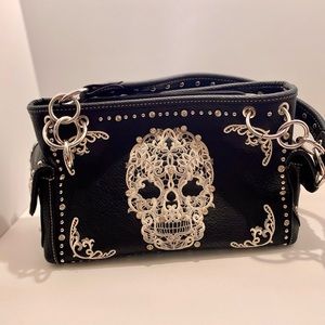 Montana West sugar skull with conceal hand bag.